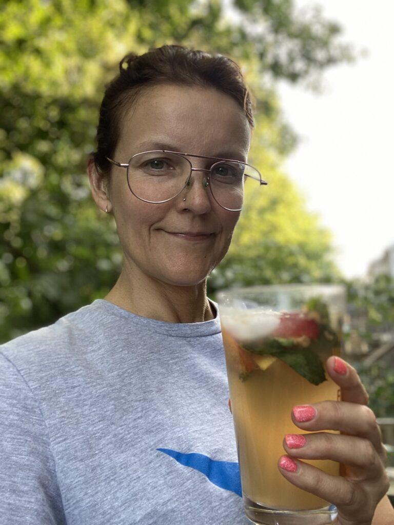 marge holding her mint tea seltzer