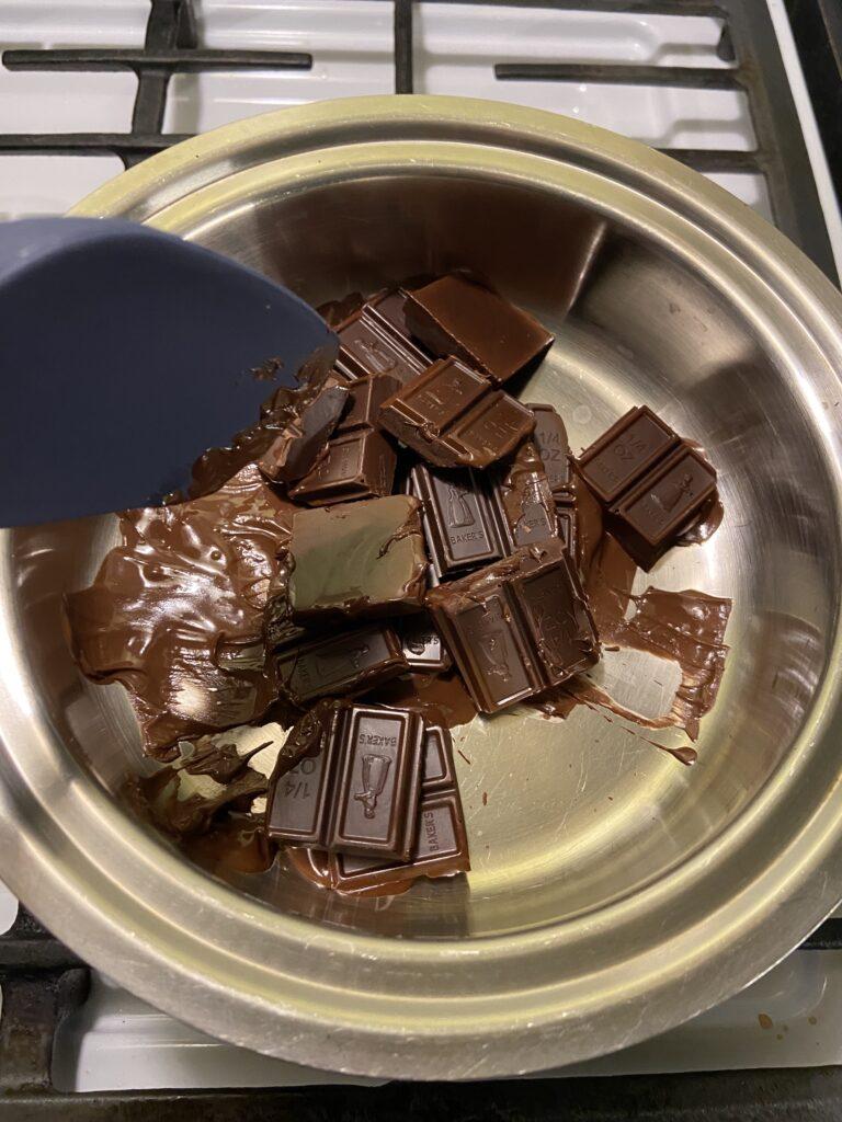 Levo Chocolate drops - chocolate squares in double broiler beginning to melt.