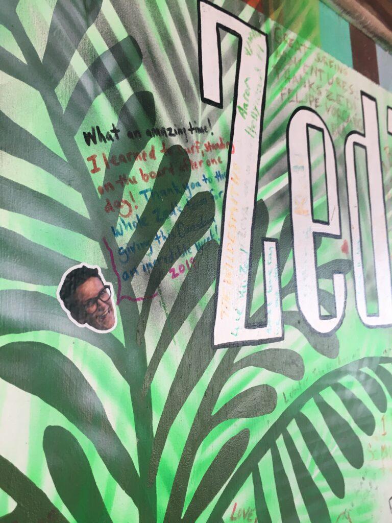 bean salad recipe episode - marge's face sticker on a sign at a guesthouse