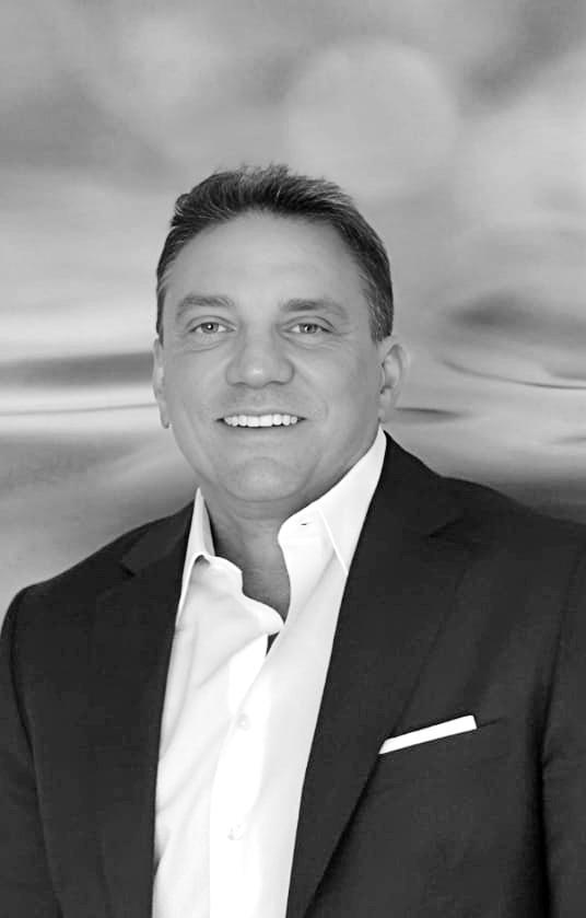 black and white photo of Keith Bushfield, CEO of Rexis Biotech