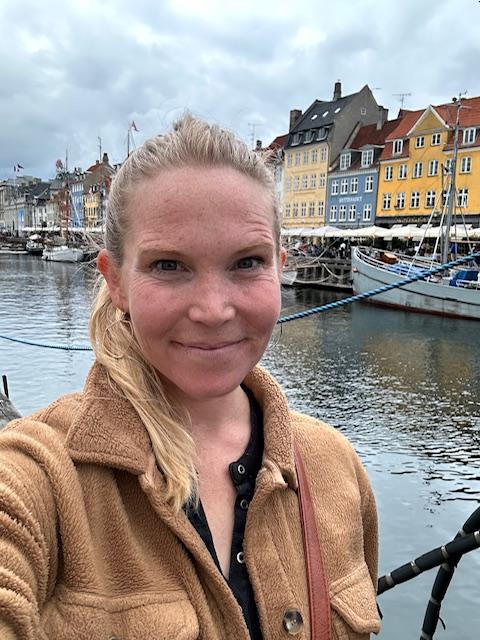 photo of dr. Whitney Ogle, cannabis and exercise research, along a canal in Amsterdam.